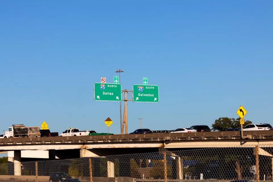 Traffic on Interstate 45 with signs leading to Dallas and Galveston.